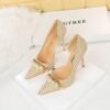 2b2bc6b24bb0a038b4c1e4c0a8a12184 8829-1 Korean version of high-heeled shoes with lattice pattern shallow mouth side hollow houndstooth pearl metal chain super high-heeled shoes