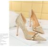 c2bb48d879d78bc7a977c53ea536cd8a 8829-1 Korean version of high-heeled shoes with lattice pattern shallow mouth side hollow houndstooth pearl metal chain super high-heeled shoes