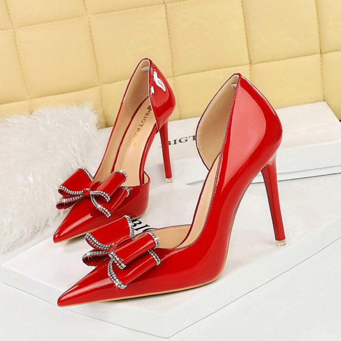 BIGTREE SHOES 638-H35 European and American Style Banquet Women's Shoes Stiletto Heel Shallow Mouth Pointed Side Hollow Patent Leather Bow Pumps - Image 1