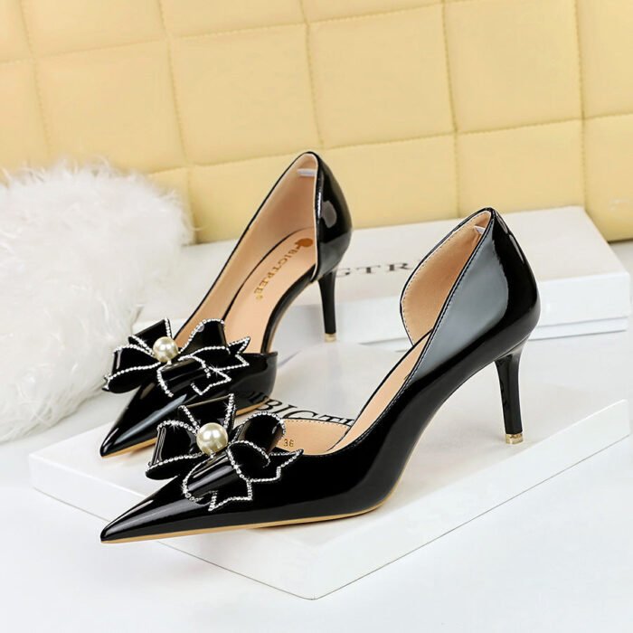 BIGTREE 638-AH13 European and American Banquet High Heel Shiny Patent Leather Shallow Mouth Pointed Side Hollow Pearl Rhinestone Bow Pumps - Image 1